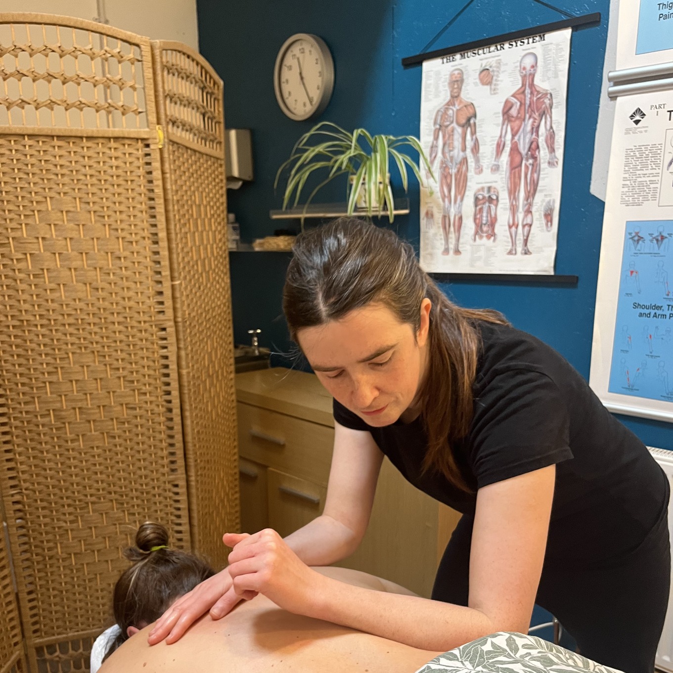 Jo Craven massage therapist massaging a person's back